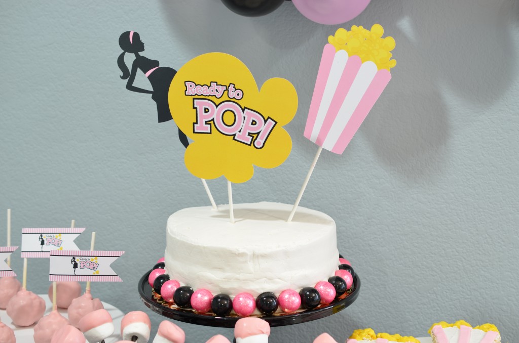 Ready To Pop Baby Shower Pink white cake with gumballs